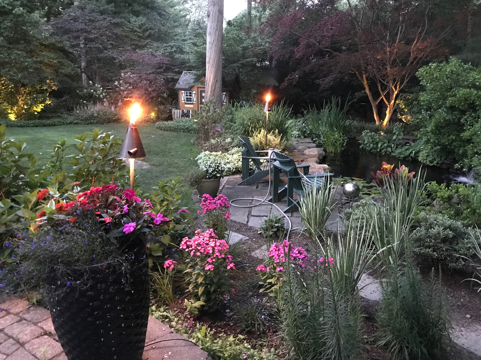 Garden seating and landscape lighting at dusk